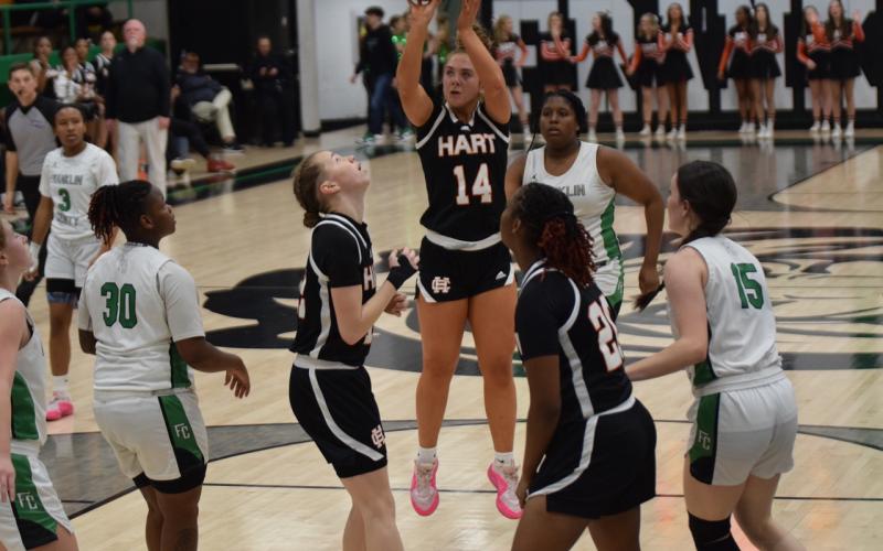 Senior guard Dakota Phillips (14) knocks down a jumper as she set a school record for the most three pointers made in a single game with nine, as she finished with 31 points in the win. Photo by Shane Scoggins/Franklin County Citizen Leader