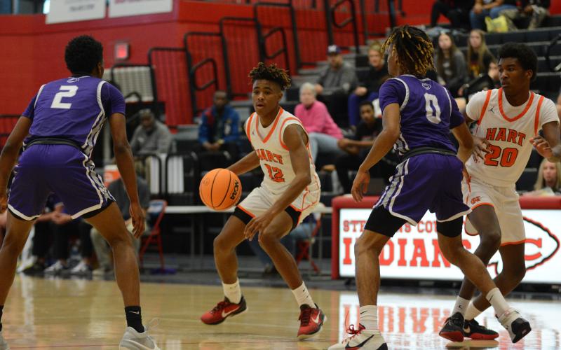 Freshman guard Kurston Curry looks for an open teammate in the 60-53 win over Monroe Area on Feb. 14 to advance to the Region 8-AAA Championship game.