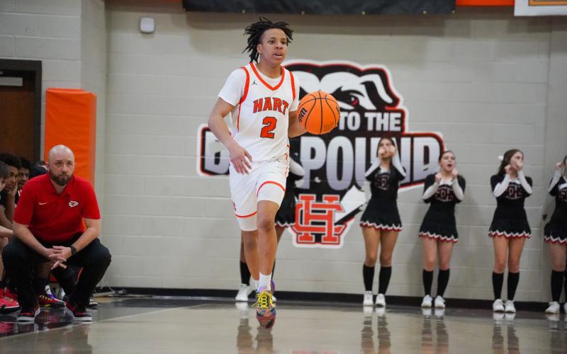 Junior guard O’Brian Evans takes the ball up the court as he was the teams second leading scorer with 13 points in the 66-64 home loss to the Indians of Stephens County on Feb. 2.