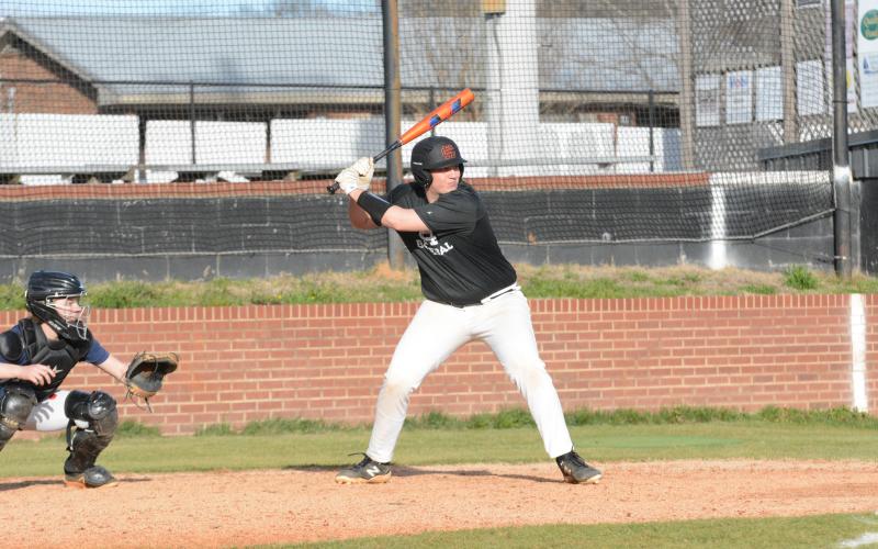 Pictured is senior infielder Owen Kesler awaits the pitch during practice.