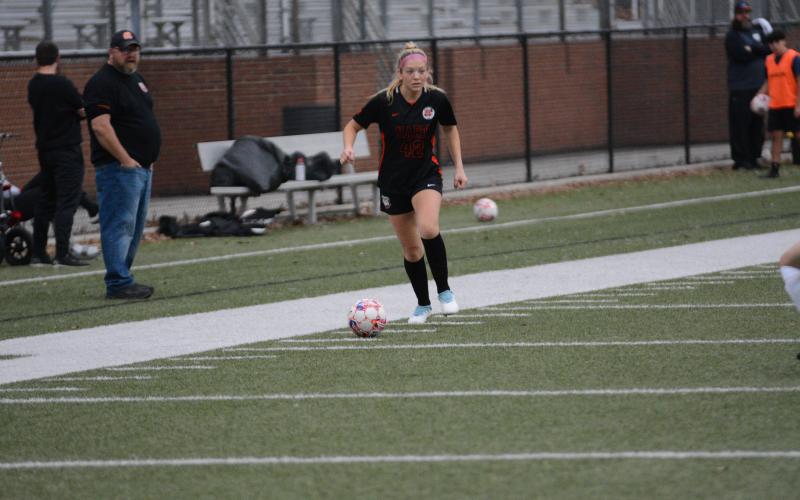 Junior midfielder Piper Phillips looks to move the ball up the right wing during the 5-3 home loss to the Lady Indians of Towns County on Feb. 27.