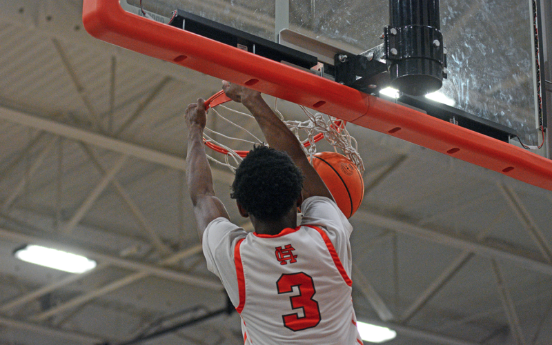 Junior guard Andrew Maxwell slams it home in the final minutes of the 80-45 home win over the Panthers of Carver-Atlanta in first round of the state playoffs on Feb. 21.