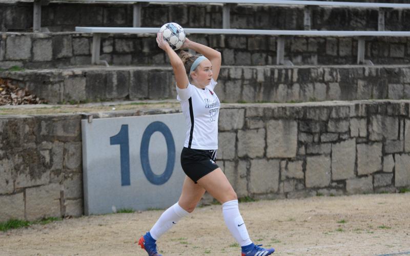 Pictured is junior midfielder Teague Pierce as she throws the ball in to play, as she scored the game winner on the road against Elbert County in the Granite Bowl on Feb. 9.