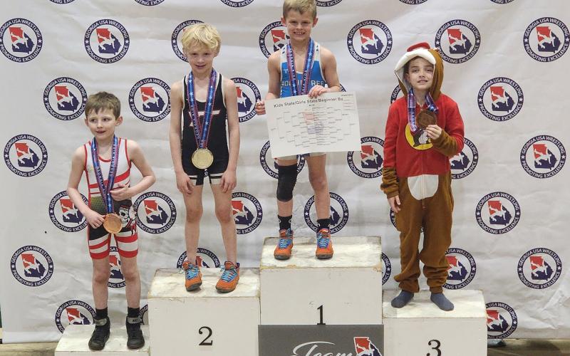 Knox Payne (pictured third from left) claimed back-to-back state championships at the Georgia Wrestling State Championship on March 3 in Perry, Ga.