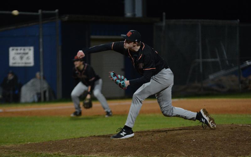 Senior pitcher Avery Strickland delivers the pitch in the 10-4 win over Elbert County on Feb. 19, as Strickland has committed and signed to play baseball at Newberry College.