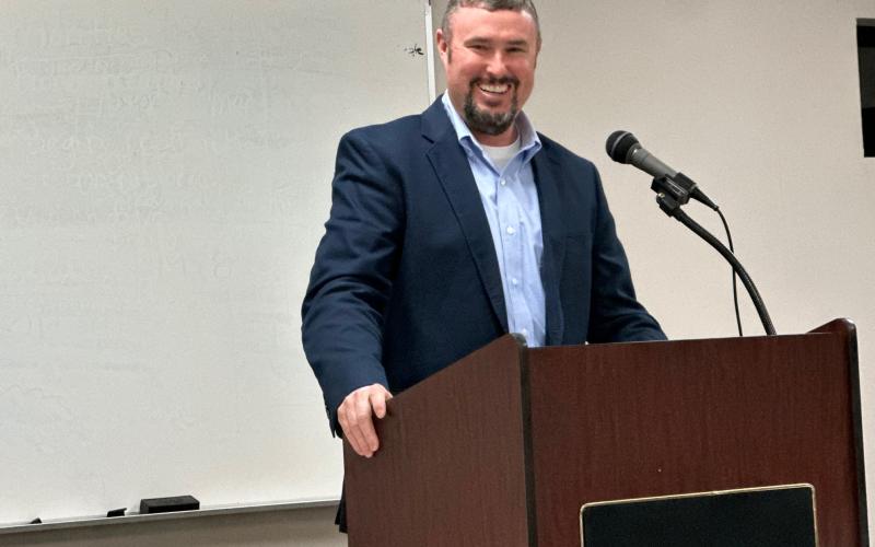 Republican candidate  for sheriff Chris Carroll speaks to a crowded house at the GOP candidate forum March 14. Carroll will take on former sheriff’s deputy Tracy Mize who is running as an independent.