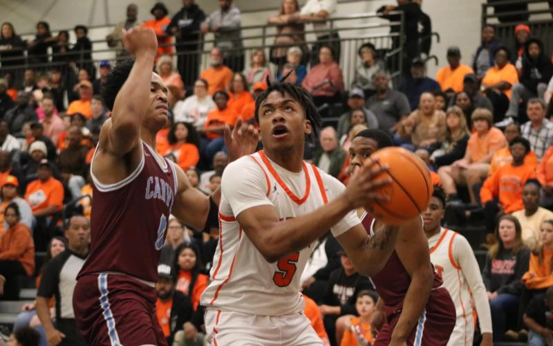 Senior guard Jashon Gaines prepares to go up for the lay up in the 76-53 loss to Carver (Columbus) on Feb. 28. Photo by Grayson Williams/ Hart County Charter System