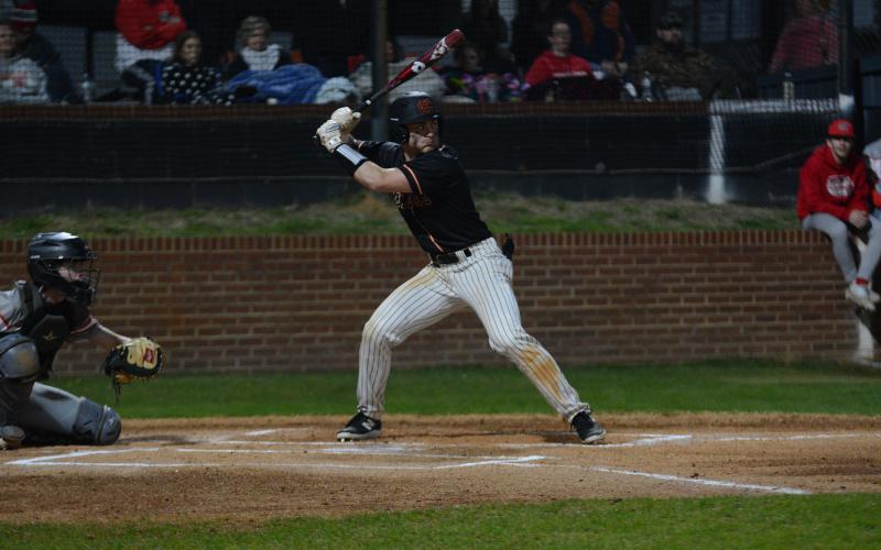 Senior outfielder Kanyon Coulter hits a three run homerun in the 11-7 game three loss to Hebron Christian.