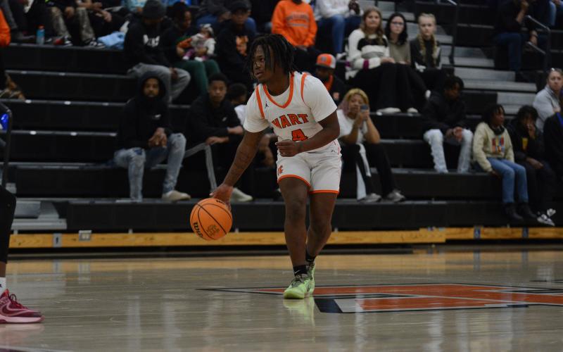 Senior guard Nori Moore sets up the offense in a game earlier this season.