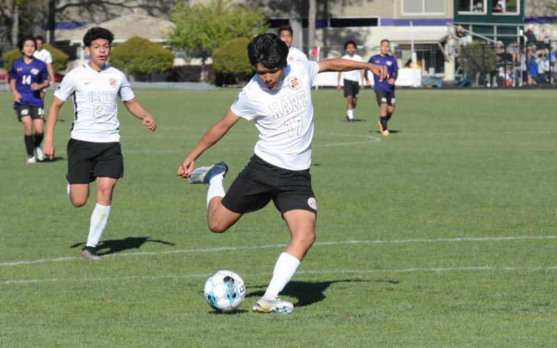 Freshman forward Manuel Sigala (right) nets a goal in the 8-0 win over Athens Christian April 5, while Eric Barrientos (left) nets a goal in the 5-1 loss over Hebron Christian April 9.
