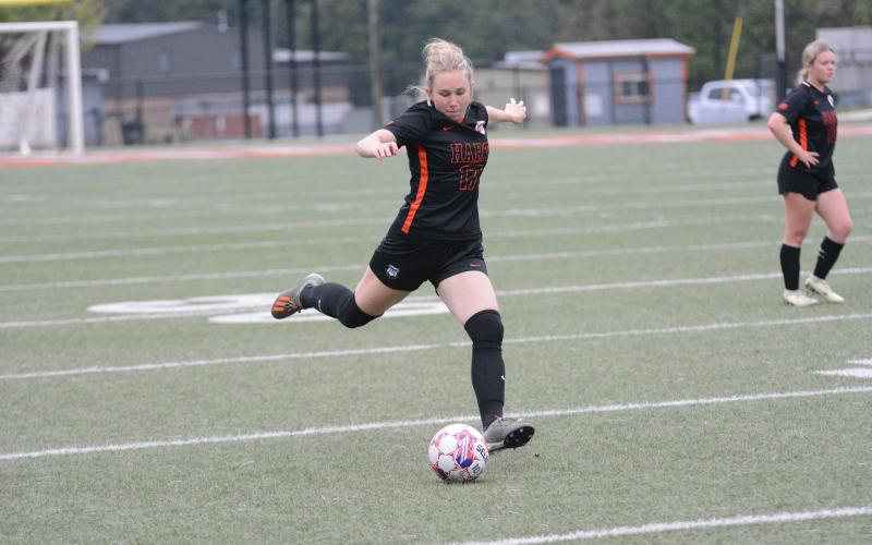 Pictured is junior midfielder Teague Pierce scores the lone goal for the Lady Dogs.