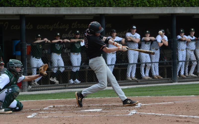 Pictured is senior pitcher Avery Strickland as he hits a home run in the top of the fourth in game one.