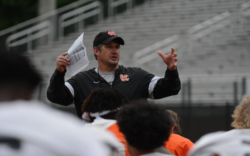 Dogs head coach Cory Dickerson addresses the team after their seventh spring practice on May 13 in Herndon Stadium.