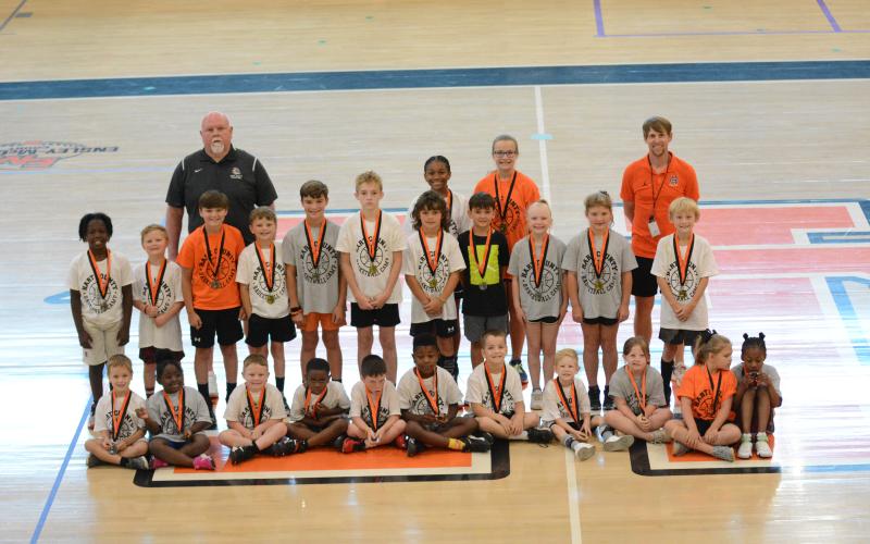 Pictured are the champions and runner-ups of the Free Throw competition along with HCHS girls coach Mike Edwards and HCHS boys coach Matt Gibbs.