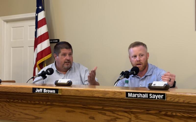Commissioners Joey Dorsey and Jeff Brown debating an agenda item related to a City of Royston annexation
