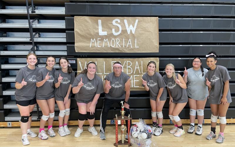 Pictured is the inaugural champions of the LSW Memorial Volleyball Tournament -- the Iron Palace, a team of former and current Hart County High School volleyball players that almost all played under Lauren. From left is Kristen Atkins, Ashlym Wicker, Alaynah Kennedy, Abby Whitaker, coach Mike Atkins, Josee Sanders, Erin Miller, Adrianna Lopez, and Alexis Walker.