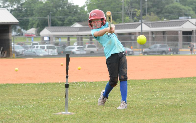Pictured is Nora Gibbs as she works on a hitting drill at the annual Hart County Little Bulldogs Softball Camp at the Hart County High School softball field on June 3-5.