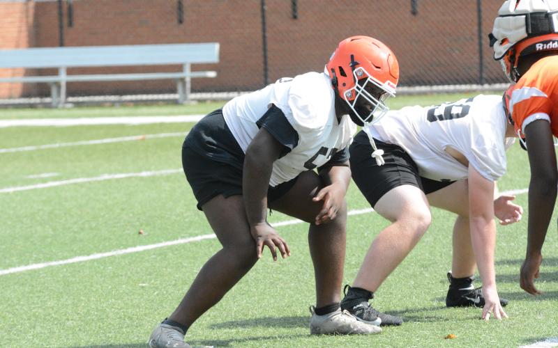 Senior offensive lineman Eykwan Hailey awaits the snap during a summer practice.