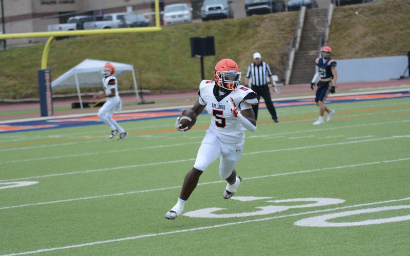 Senior defensive end and tight end Isaac Durrett looks up the field after making the catch in the 2024 Spring Game.