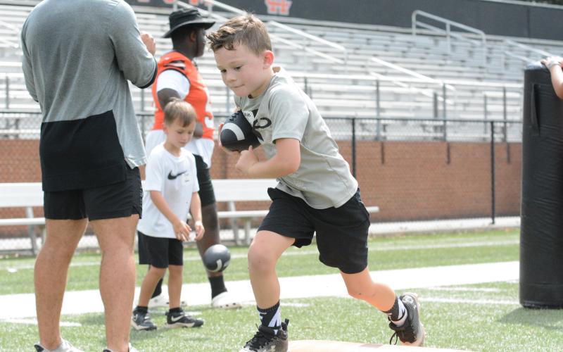 Pictured is Kayde Barrow as he scooped the fumble and looked to score in a drill at the 2024 Little Bulldogs Kids Football Camp in Herndon Stadium on July 19.