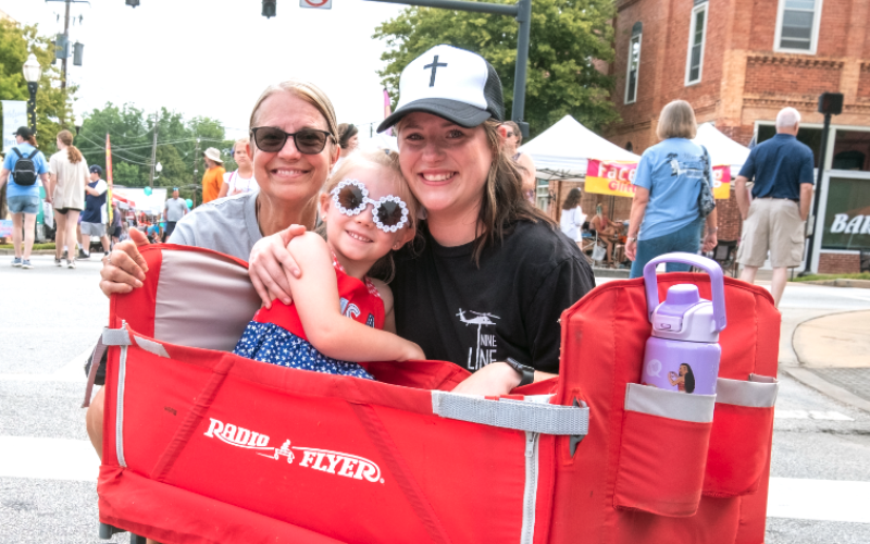 Alisa Byrum (left) with her grandaughter Ellie Jones and daughter Mollie Jones walk through downtown Hartwell.