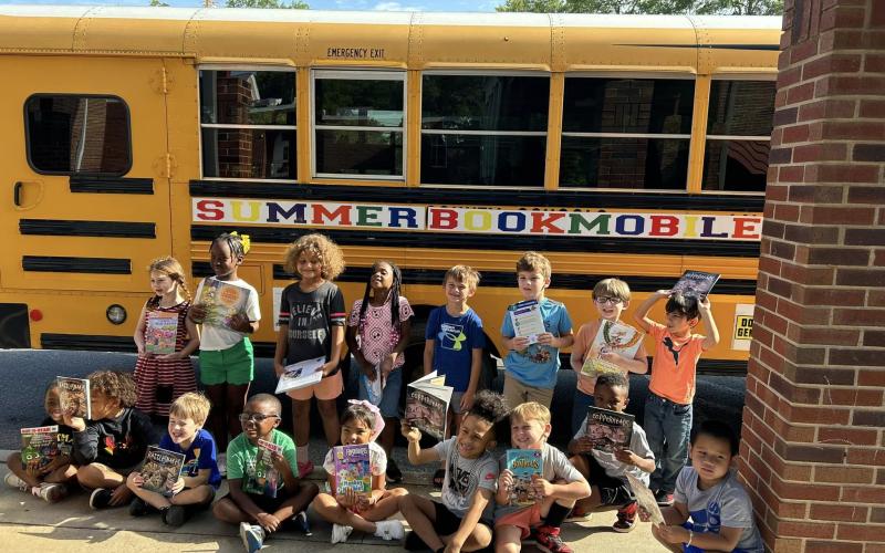 The 2024 summer bookmobile presented by Hart Partners makes a stop at a local elementary school.