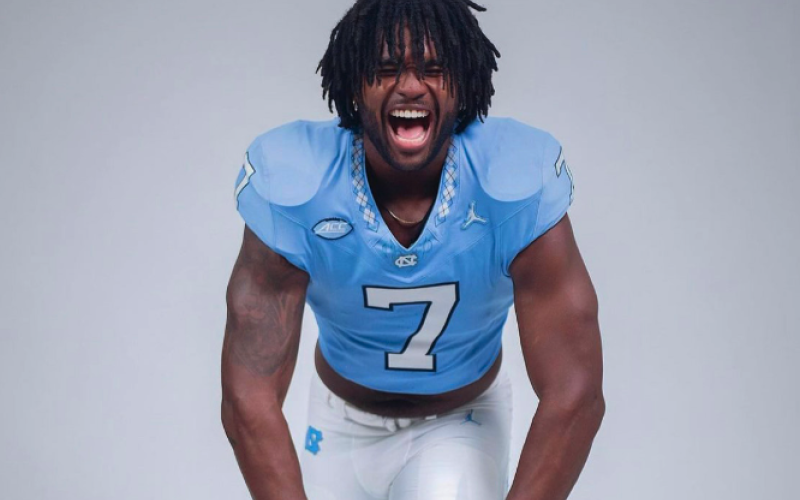 Fifth-year senior defensive end, Kaimon Rucker, poses during media day.
