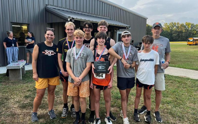 Pictured is the boys team as they placed first overall at the Granite City Invitational.