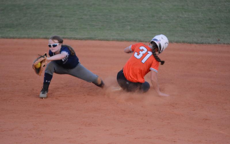 Senior outfielder Emma Faust slides into second safely to collect a stolen base against East Jackson on Sept. 3.