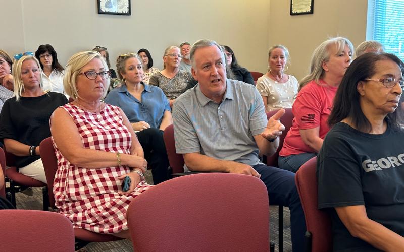 Community members such as Dan Casey attended the Sept. 9 Hartwell City Council meeting to voice concerns about the firing of former Chamber of Commerce Executive Director Lindsey Ingle (located behind Casey, in blue).