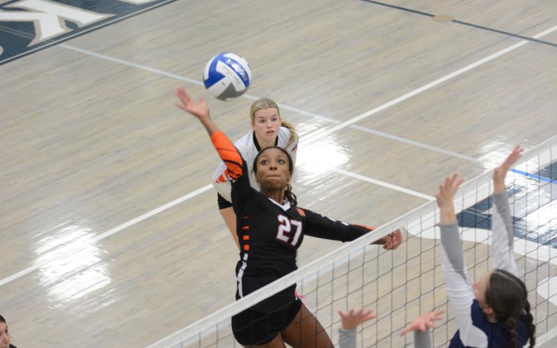 Freshman Trinity Freeman goes for the kill in the 2-0 loss to East Jackson, 21-25 and 20-25, on Sept. 24.