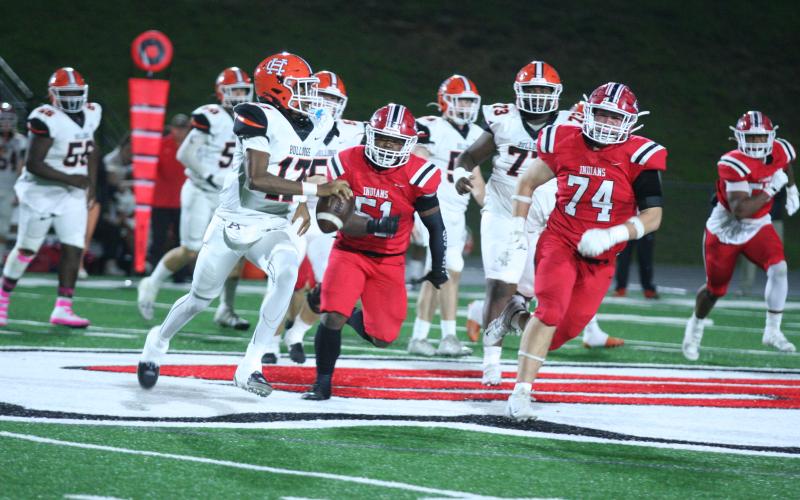 Hart County’s sophomore quarterback Kurston Curry (left) looks to evade the pressure by the Indians defenders in the 37-34 loss to Stephens County on the road on Oct. 25. Photo by Laura Shaw/The Toccoa Record.