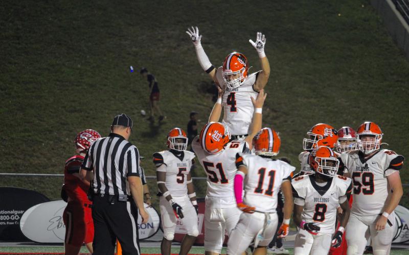 Senior wide receiver Pearce Mewborn celebrates with his teammates after a 10-yard touchdown reception to begin the second half of play in the 37-34 loss to Stephens County Oct. 25. Photo by Madison McLane.
