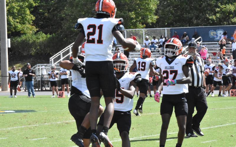 Junior safety Ramarcus Simpson (21) celebrates after an interception in the 43-21 loss to Prince Avenue on Sept. 28. Photo by Stuart Steele/The Oconee Enterprise