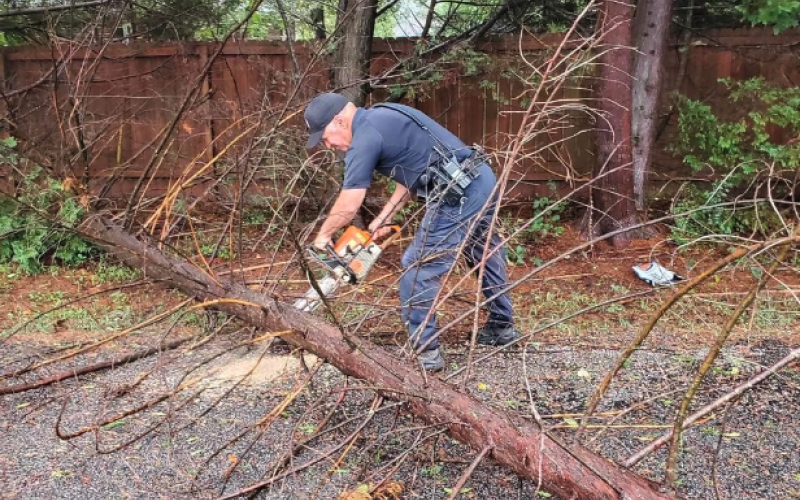 Officer Keith Cheek of the Hartwell Police Department brought his chain saw to work on Friday to help remove debris in the aftermath of Hurricane Helene.