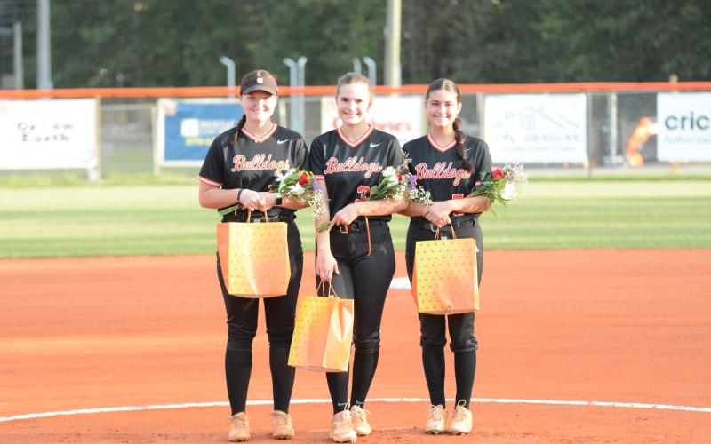 From left are seniors Skylar Dutton, Emma Faust, and Natalie Morgan who were honored pre-game against Commerce.