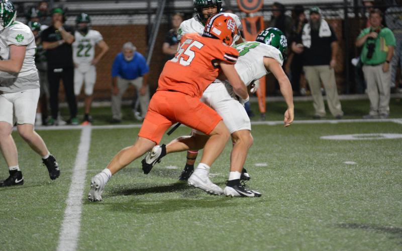 Junior defensive end Hunter Dutton sacks the quarterback in the backfield in the 29-9 win over Franklin County.