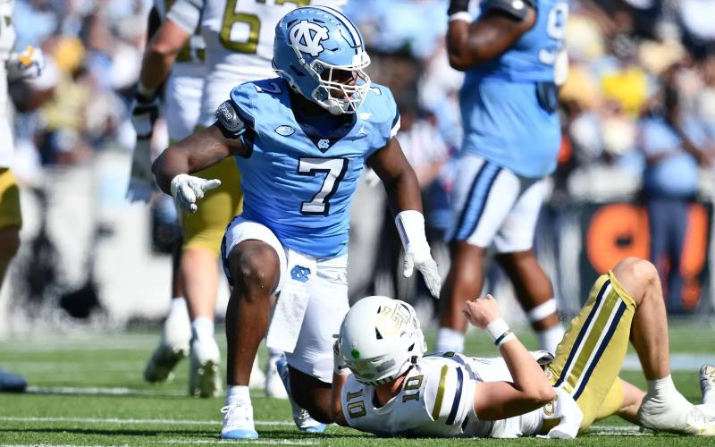 Former Hart County and current UNC edge rusher Kaimon Rucker pressures Georgia Tech’s quarterback Haynes King in the 41-34 loss to the Yellow Jackets in Chapel Hill on Oct. 12. Photo by Anthony Sorbellini/UNC Athletics