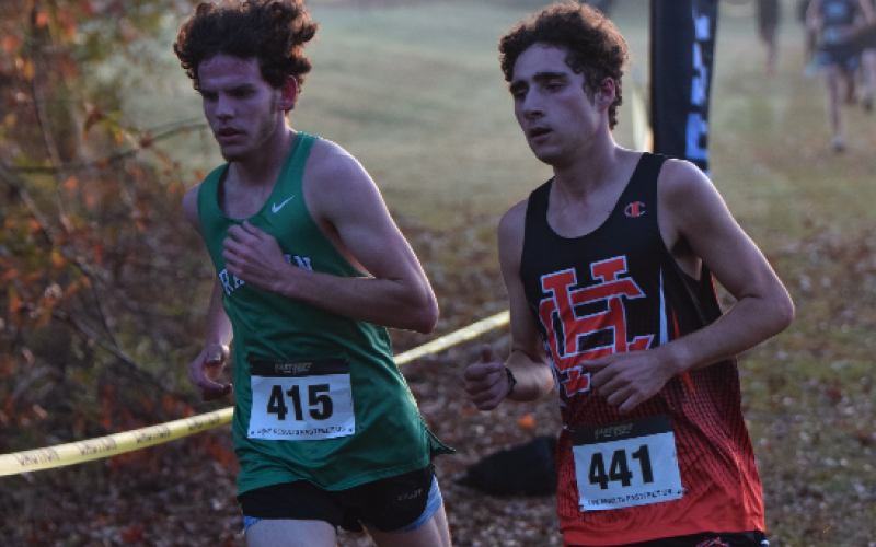Senior Nate Harris (right) beats out the runner from Franklin County to place first overall at Sectionals on Nov. 2. Photo by Shane Scoggins/Franklin County Citizen Leader.