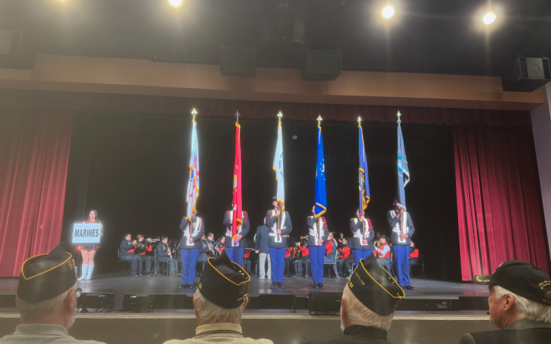 The Hart County Army JROTC color guard holds the flags of the armed forces while the HCHS Symphonic Band plays the anthem of each branch of service.