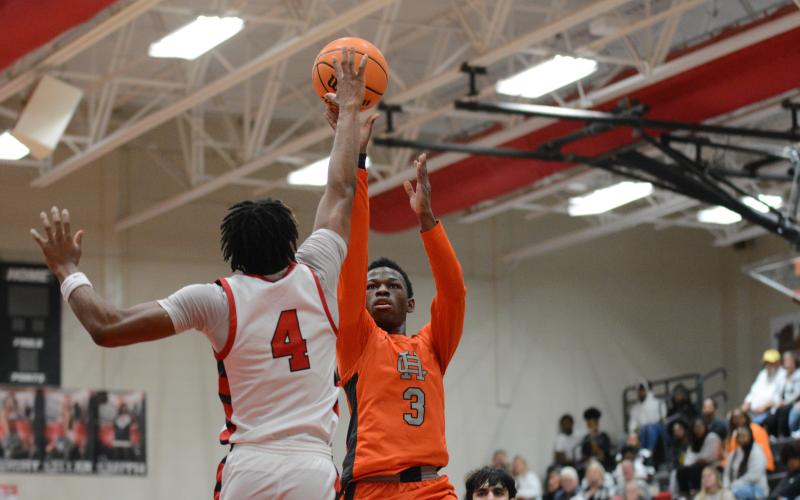 Senior guard Andrew Maxwell gets the tear dropper to go over a Red Raider defender in the 68-61 loss to Madison.
