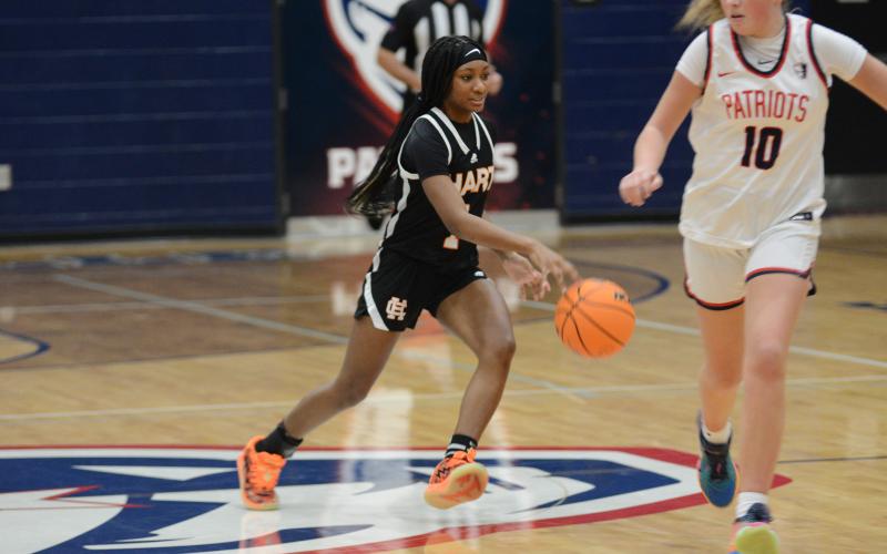 Sophomore guard Jaycee Wiley brings the ball up the court earlier in the season.