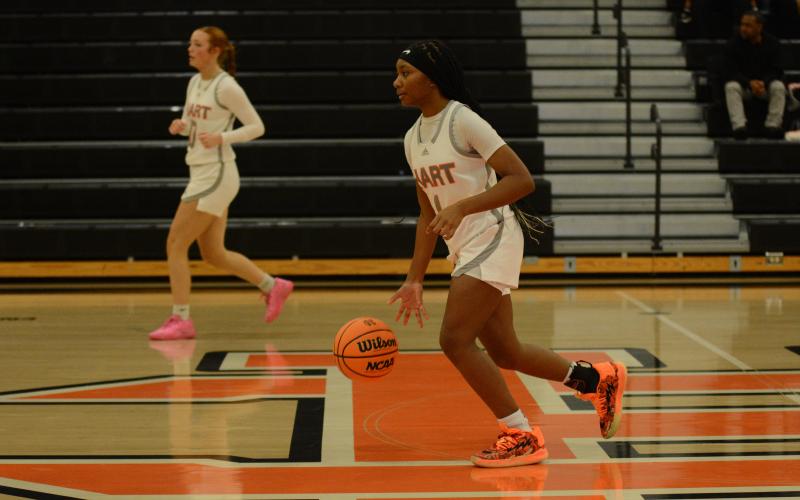 Sophomore guard Jaycee Wiley dribbles the ball up the court in the 45-43 win over Athens Academy on Dec. 10.
