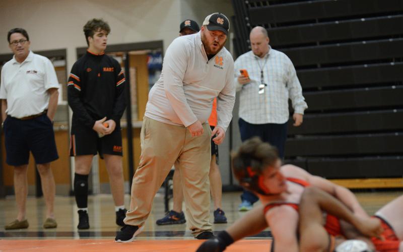 Mat Dogs head coach Sam Simpson coaching during a match back on Nov. 20.