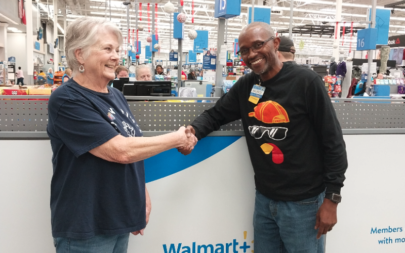Maurice Jones, Store Manager of Hartwell Walmart presents check to Claudia Kay,  Love Him Love Them Volunteer, in support of the Thanksgiving Day Event.  Over 5,000 meals were prepared and delivered.