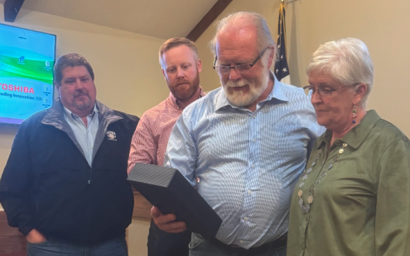 Pictured above (from left to right): Commissioners Joey Dorsey, Jeff Brown and Marshall Sayer present retiring county clerk Lawana Kahn with a plaque commemorating her four decades of service.