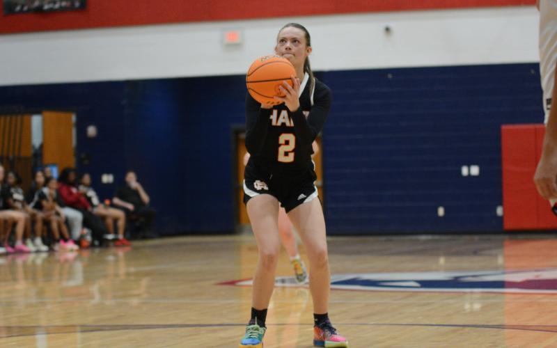 Senior guard Zoe Carter shoots a free throw in a game earlier this season.