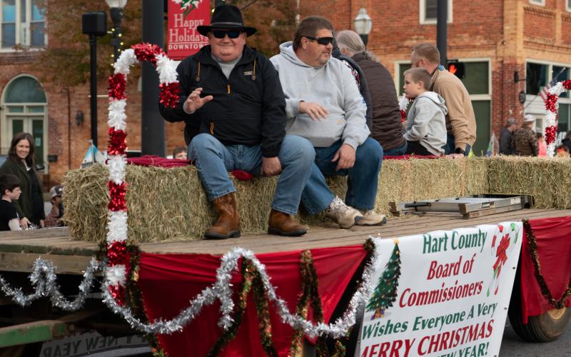 Hart County Commissioners Frankie Teasley (left) and Joey Dorsey ride in the 2024 Hartwell Christmas parade.