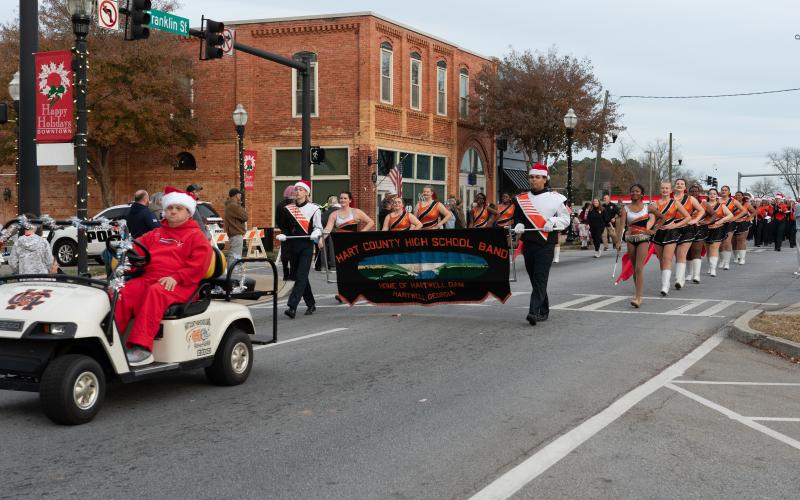 Hart County Commissioners Frankie Teasley (left) and Joey Dorsey ride in the 2024 Hartwell Christmas parade.