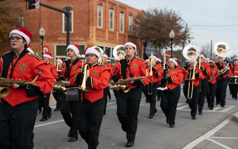 Hart County Commissioners Frankie Teasley (left) and Joey Dorsey ride in the 2024 Hartwell Christmas parade.